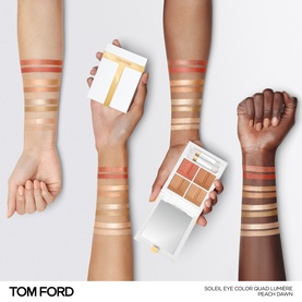 TOM FORD Soleil Eye Colour Quad Lumi&egrave;re in Peach Dawn swatched on three arms of different skin tones, palette shown alongside