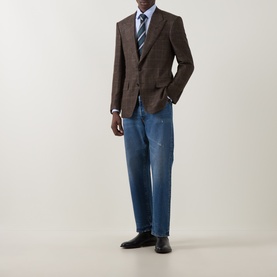 Model wearing Tom Ford Black Brown wool-silk-linen blazer jacket, styled with blue jeans, striped tie and white shirt