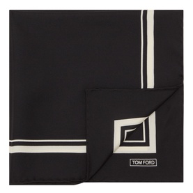 Tom Ford black silk pocket square with cream border stripe and geometric corner motif, folded flat to show logo detail