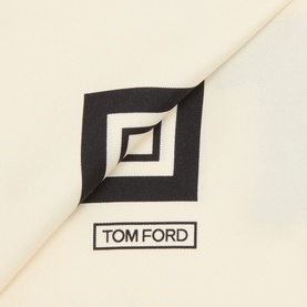 Tom Ford off white silk pocket square, close-up showing woven label with geometric logo detail