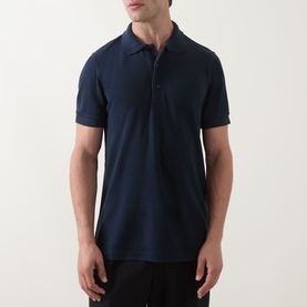 Model wearing Tom Ford Pique Regular Fit Polo Shirt in navy, short sleeves, button-down placket, polo collar, regular fit