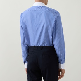 Model wearing Tom Ford Stripe Contrast Shirt in blue and white, back view, styled with navy trousers. White contrast collar and single cuffs visible.