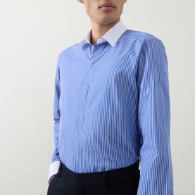 Model wearing Tom Ford Stripe Contrast Shirt in blue and white, slim fit with pointed white contrast collar and long sleeves, styled with black