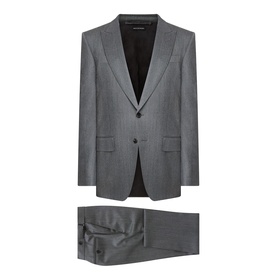 Tom Ford grey wool suit with single-button jacket, peak lapels and matching tailored trousers, laid flat on white background.