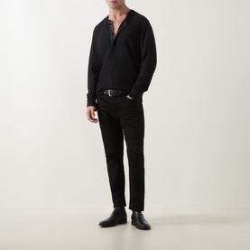 Model wearing Tom Ford black wool-silk-cashmere top with V-neck, styled with black slim trousers and black leather shoes.