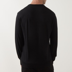 Model wearing Tom Ford black wool-silk-cashmere long-sleeve T-shirt, rear view showing relaxed fit and clean neckline.