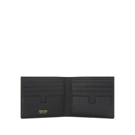 Tom Ford black bifold wallet open, showing multiple card slots and gold-tone branding tab, grained leather interior
