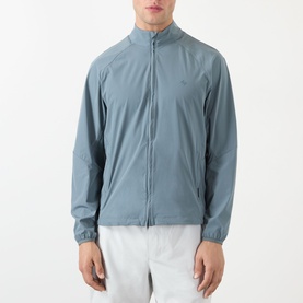 Model wearing 247 Casual Jacket in dusky navy, lightweight zip-through style with stand collar and elasticated cuffs, styled with white shorts