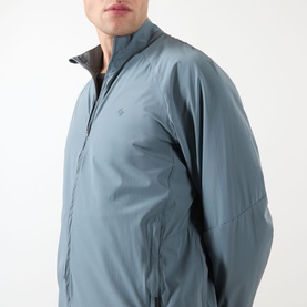 Model wearing 247 Casual Jacket in Dusky Navy, lightweight nylon with zip front and stand collar, close-up chest detail shot.