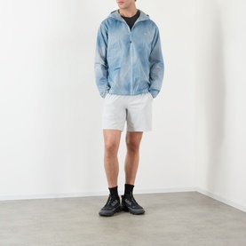 Model wearing 247 Casual Jacket in Glacier Fade Out, styled with white shorts and black ankle boots.
