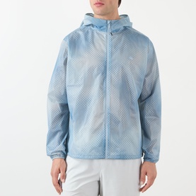 Model wearing 247 Casual Jacket in Glacier Fade Out, lightweight hooded zip-up with all-over geometric print, styled with white shorts