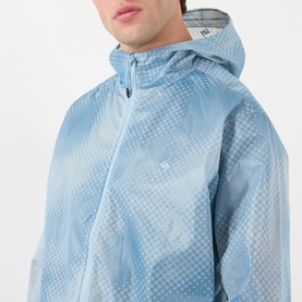 Model wearing 247 Casual Jacket in Glacier Fade Out, lightweight transparent blue with allover dot print and hood, zip fastening