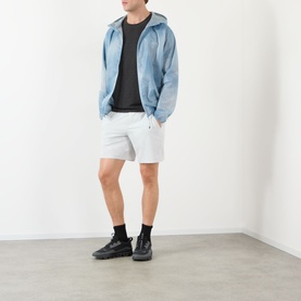Model wearing 247 Casual Jacket in Glacier Fade Out, styled with white shorts and black high-top trainers