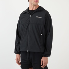 Model wearing 247 Casual Jacket in Jet Black, zip-up hooded style with chest logo print and elasticated cuffs.