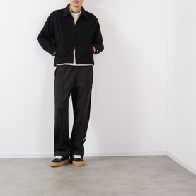 Model wearing Almost Home OG Twill Jacket in Storm Black with matching black trousers and dark trainers with gum soles.
