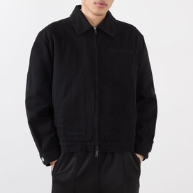 Model wearing Almost Home OG Twill Jacket in Storm Black with zip fastening, spread collar, and utility chest pocket, styled with black trousers