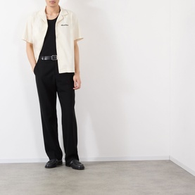 Model wearing Almost Home Logo Bowling Shirt in Cloudskin with black trousers, vest and leather shoes.