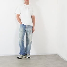 Model wearing Almost Home Blue Print T-Shirt with light wash distressed jeans and grey trainers