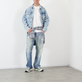 Model wearing Almost Home Blue Print T-Shirt, styled with light wash denim jacket, distressed jeans, and grey trainers