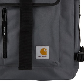 Carhartt Philis Logo Backpack in Styx grey, showing front zip pocket, branded patch logo, and black webbing strap detail