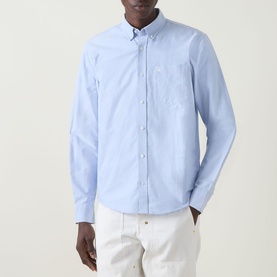 Model wearing Carhartt C-Logo Logo Patch Pocket Shirt in Bleach/White, lightweight Oxford fabric, button-down collar, chest patch pocket, styled with
