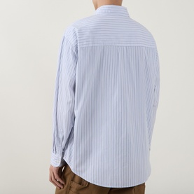 Model wearing Carhartt casual shirt in Keene Stripe/White, 100% cotton, rear view, styled with tan trousers