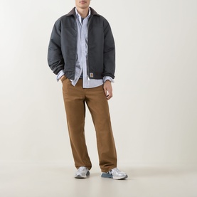 Model wearing Carhartt Keene Stripe/White casual shirt, styled with charcoal jacket, tan trousers and grey trainers