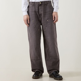 Model wearing Carhartt OG Double Knee Straight Jeans in Tobacco, loose straight-cut legs with double-layer knees and paint splatter detail, styled
