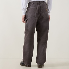 Model wearing Carhartt OG Double Knee Straight Jeans in Tobacco, showing rear view with loose straight-cut legs, double-layer knees and tool pockets.