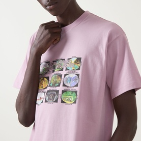 Model wearing Carhartt Coordinates Logo T-Shirt in Hortensia pink, featuring multicolour grid graphic print on chest, crew neck, short sleeves