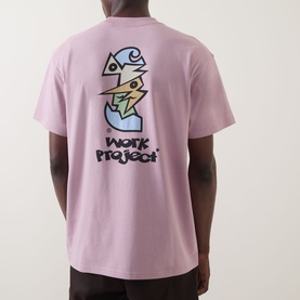 Model wearing Carhartt Cubist Logo T-Shirt in Hortensia pink, back view showing abstract cubist graphic print and Work Project text.