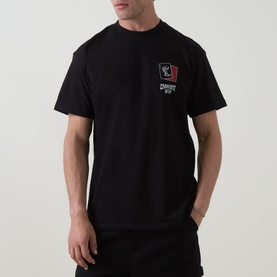 Model wearing Carhartt Playing Cards Logo T-Shirt in black, featuring small chest graphic, crew neck, and short sleeves.