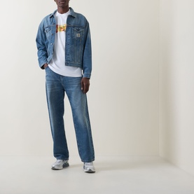 Model wearing Carhartt Road Side Snack T-Shirt in White with denim jacket, wide-leg blue jeans and grey trainers.