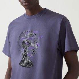 Model wearing Carhartt Fan Graphic Logo T-Shirt in Shady Purple, featuring fan graphic print, crew neck, short sleeves.