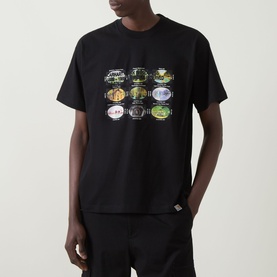 Model wearing Carhartt Coordinates Logo T-Shirt in black, featuring a multicoloured grid graphic print on the front, crew neck, short sleeves.