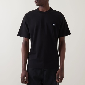 Model wearing Carhartt Madison Logo T-Shirt in black with white embroidered chest logo, crew neck, short sleeves, straight hem.