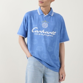 Model wearing Carhartt Terrace Logo Football T-Shirt in Curacao blue, polo collar, short sleeves, white tipping detail, styled with light wash jeans