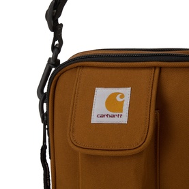 Carhartt Essentials Logo Crossbody Bag in Hamilton Brown, black zip and hardware, woven logo label, exterior front pocket visible.