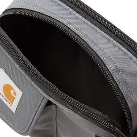 Carhartt General Crossbody bag in Styx grey, open zip compartment view, black zip detail and branded logo patch visible.