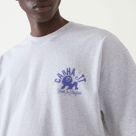 Model wearing Carhartt Built Different Logo T-Shirt in Ash Heather, crew neck, with blue Work In Progress chest graphic.