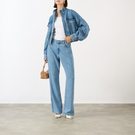 Model wearing Max Mara Sportmax Bussola Denim Bomber Jacket in Midnight Blue with matching wide-leg jeans, white tee, and tan bag.