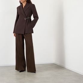 Model wearing Max Mara Sportmax cocoa belted jacket with matching wide-leg trousers