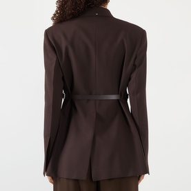 Model wearing Max Mara Sportmax cocoa jacket, rear view, with slim black belt detail and matching wide-leg trousers