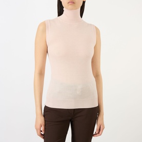 Model wearing Max Mara Sportmax pink sleeveless turtleneck knit top in virgin wool, styled with dark brown trousers.