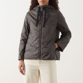 Model wearing Max Mara Cube Greenh Padded Hooded Jacket in kaki with drawstring hood and zip fastening, styled with cream wide-leg trousers.