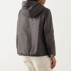 Model wearing Max Mara Cube Greenh Padded Hooded Jacket in khaki, rear view, with drawstring hood and zip fastening, styled with cream trousers.