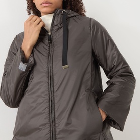 Model wearing Max Mara Cube Greenh Padded Hooded Jacket in kaki, showing drawstring hood detail and zip fastening at neckline.
