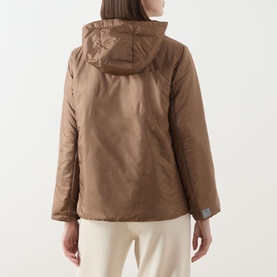 Model wearing Max Mara Cube honey quilted hooded jacket, back view, styled with cream wide-leg trousers