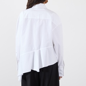 Model wearing Max Mara Sportmax Arcella Asymmetric Shirt in Optical White, showing back view with asymmetric flounce hem and deep side slit