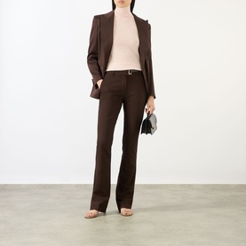 Model wearing Max Mara Sportmax cocoa flared trousers, styled with matching blazer, blush turtleneck, and strappy heels